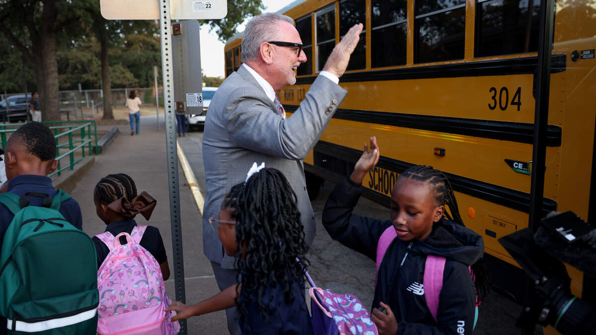 Fort Worth Independent School District Superintendent Peter Licata high-fives students as they arrive at W.M. Green Elementary School for the first day of school on Monday, Aug. 10, 2026, in Fort Worth.